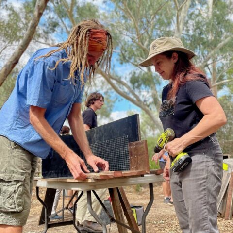 Simon and volunteer building