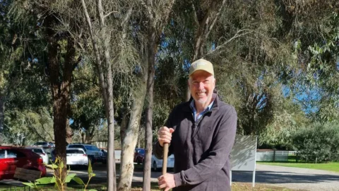 Mark Hullett planting a tree